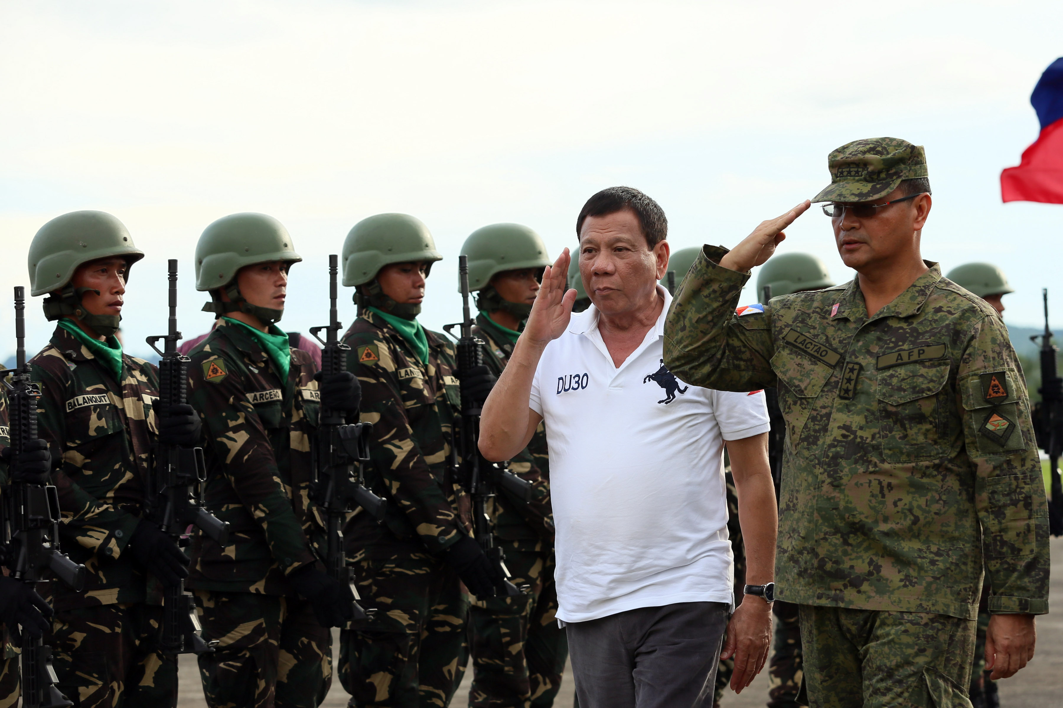DUTERTE. President Rodrigo Roa Duterte is accompanied by Armed Forces of the Philippines Central Command Chief Lt. Gen. Oscar Lactao as the President is accorded with military honors upon his arrival at the at the Ormoc City Airport for his visit to the earthquake-ravaged Leyte on July 13, 2017. Photo by ROBINSON NINAL JR./PRESIDENTIAL PHOTO 