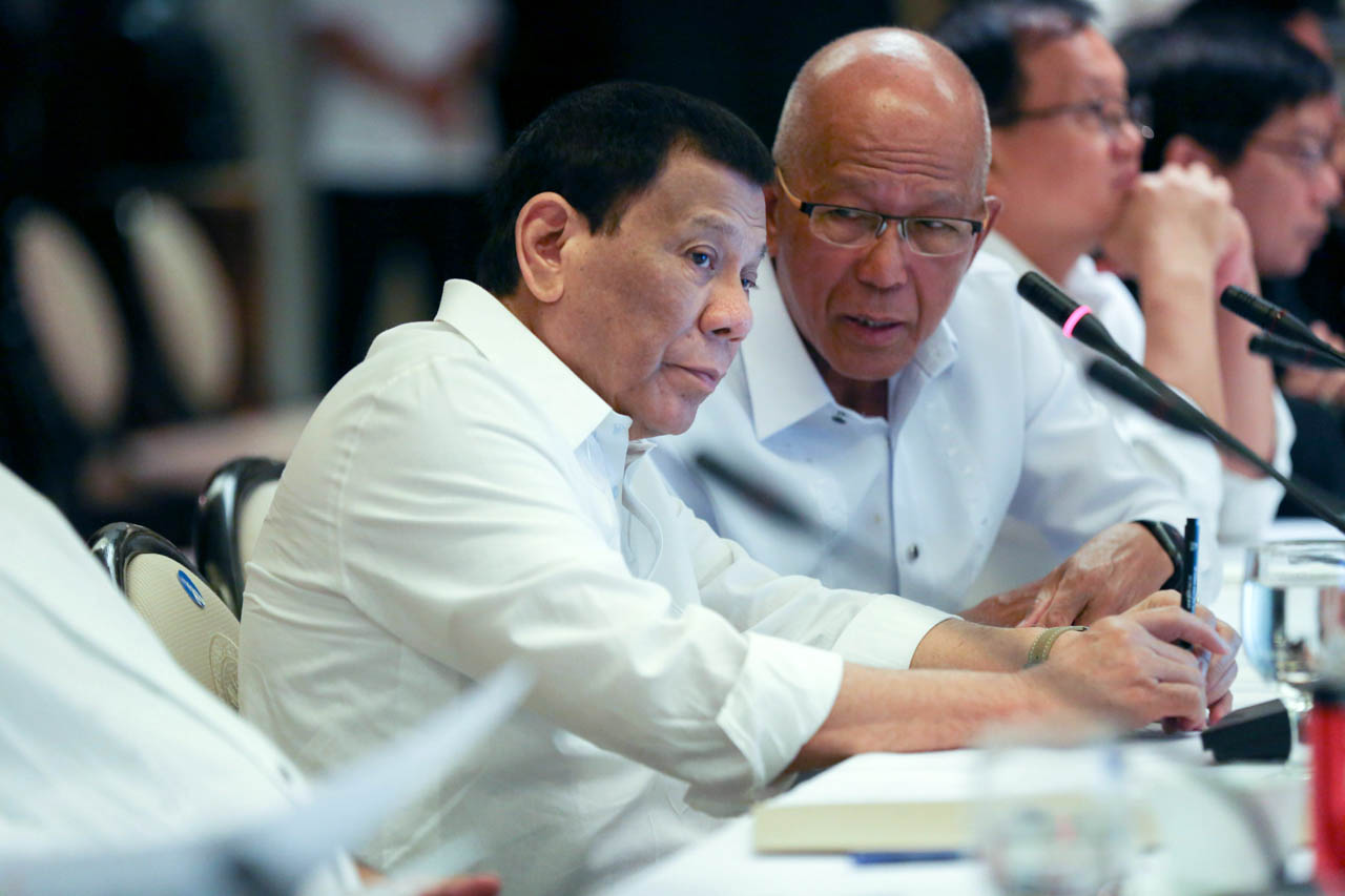 MESSAGE TO FISHERMEN. In this file photo, President Rodrigo Duterte discusses matters with Defense Secretary Delfin Lorenzana on the sidelines of the Joint Armed Forces of the Philippines-Philippine National Police Command Conference at the Malacañang Palace on June 18, 2019. Simeon Celi Jr./Presidential Photo 