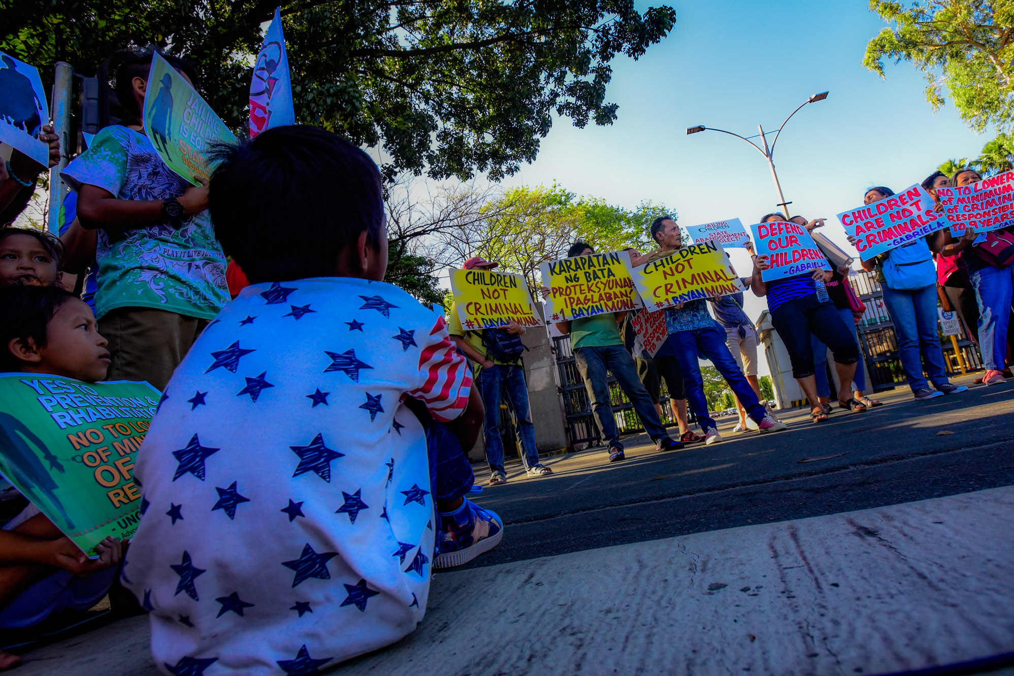 PROTECT CHILDREN. Child rights defenders hold a protest action as the House of Representatives debated on proposed legislation to lower the minimum age criminal responsibility. Photo by Maria Tan/Rappler  