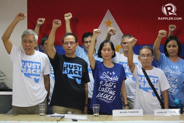 NDF. Benito Tiamzom and wife Wilma Tiamzon (next) along with recently released political prisoners during press conference at the Immaculate Conception Multi-purpose Hall in Cubao, Quezon City on August 19. Photo by Joel Liporada/Rappler 