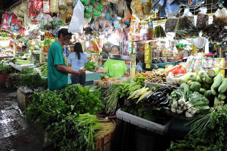 HIGHER PRICES. Higher price increases are noted for rice, corn, fish, fruits, and vegetables in March 2018. File photo by Jay Directo/AFP 
