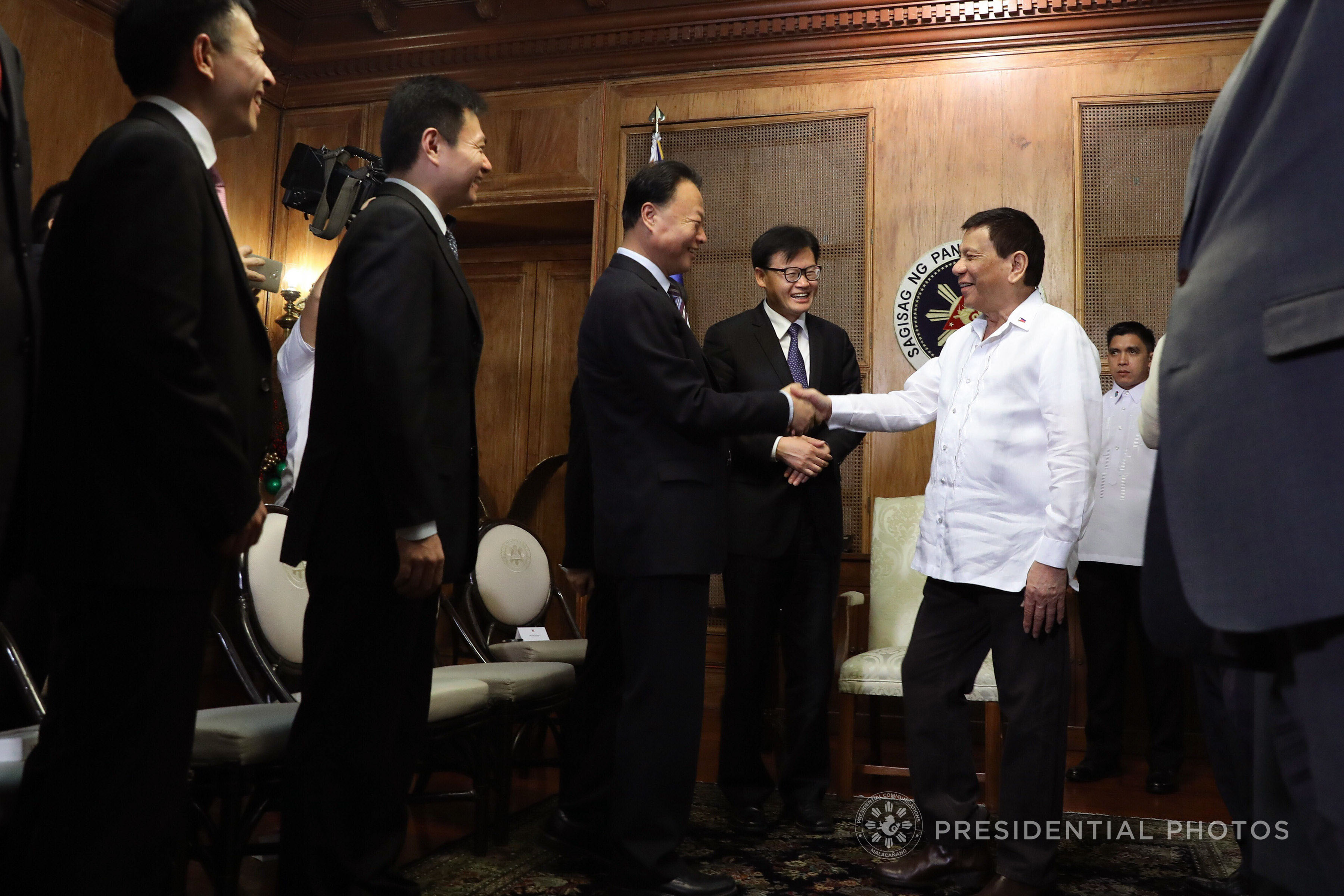 FRIENDSHIP WITH BEIJING. President Rodrigo Duterte greets Chinese Ambassador to the Philippines Zhao Jianhua as the latter accompanied the Communist Party of China Central Committee Members to Malacañang. Malacañang file photo  