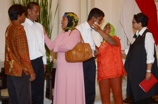 FINALLY TOGETHER. Indonesian Minister of Foreign Affair Retno Marsudi (R) looks on as Adi Manurung (3rd R), and Supardi (2nd L), two of four freed Indonesian sailors who were held hostage for nearly five years by Somali pirates, are reunited with relatives at the Foreign Ministry office in Jakarta on October 31, 2016. Photo by AFPThe four Indonesian sailors are part of a group of 26 hostages released by Somali pirates earlier this month after being held for nearly five years following the hijacking of their fishing vessel. / AFP PHOTO / ADEK BERRY 