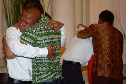 REUNITED. Elson Pesireron (L) hugs his brother Sammy as he and other freed Indonesian sailors who were held hostage for nearly 5 years by Somali pirates reunite with family members at the Foreign Ministry office in Jakarta on October 31, 2016. Photo by AFPThe four Indonesian sailors are part of a group of 26 hostages released by Somali pirates earlier this month after being held for nearly five years following the hijacking of their fishing vessel. / AFP PHOTO / ADEK BERRY 