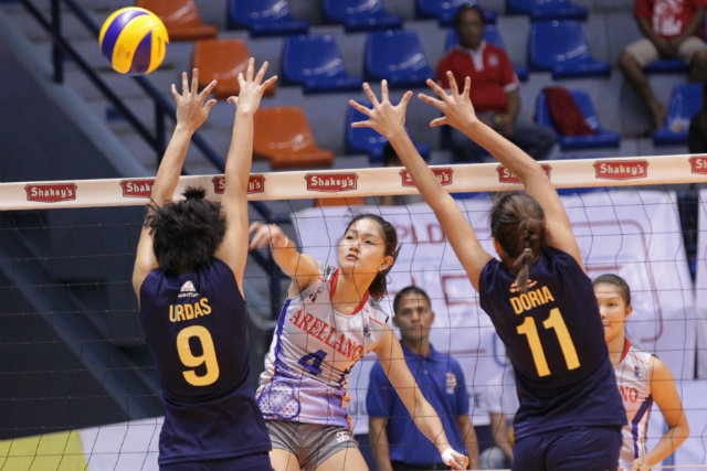 CHIEF ROCKA. Carmina Aganon of Arellano University hits the ball past National University defenders. AU won the game in 4 sets. Photo by Czaesar Dancel/Rappler   