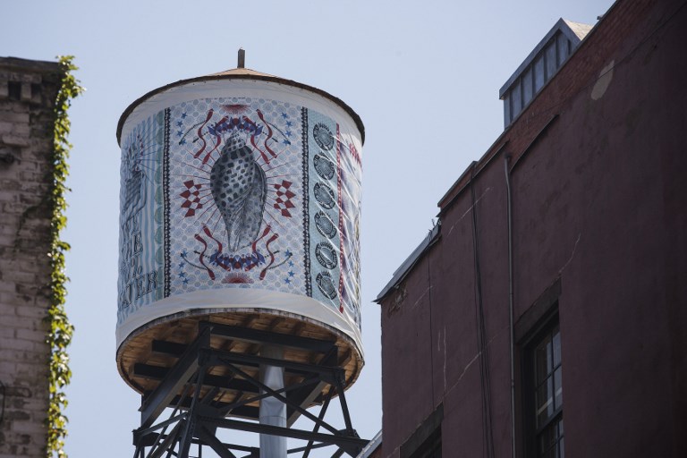 ROOFTOPS. A water tank, reimagined and wrapped as an artistic canvas by artist Lorenzo Petrantoni for The Water Tank Project, is seen at 393 West Broadwayin the SoHo neighborhood of New York City. Photo by Andrew Burton/Getty Images/AFP 