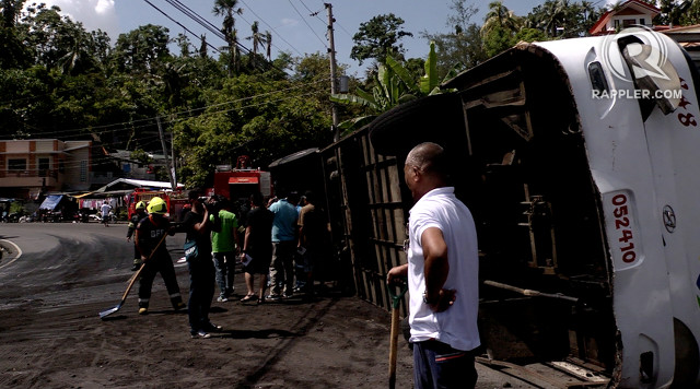 BUS CRASH. A Don Don Liner bus bound for Legazpi City, Albay loses its balance and falls on its side after hitting a cement wall in October 2014. File photo by Naoki Mengua/Rappler  