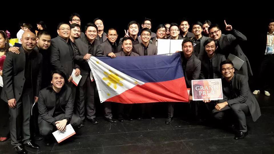 ALERON. Waving the Philippine flag proudly, the group is all smiles as members celebrate their win. Photo from Facebook 