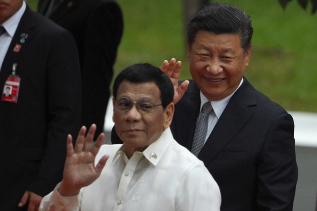 TALE OF TWO PRESIDENTS. China is out against gambling as the Philippines embraces the industry. File photo by Ted Aljibe/AFP 