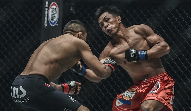REDEMPTION. Kevin Belingon exacts revenge on Bibiano Fernandes to become the third undisputed ONE champion from Team Lakay. Photo from ONE Championship 