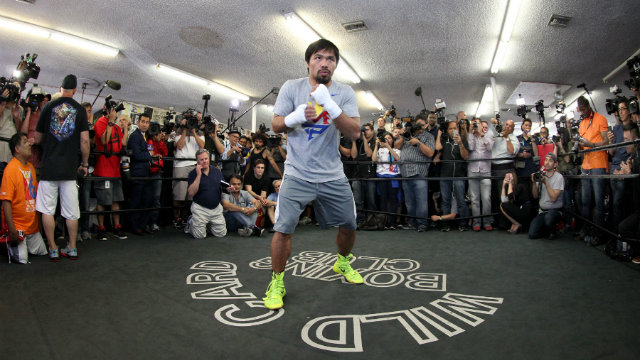 Manny Pacquiao shadow boxes at media day for the Floyd Mayweather fight. Photo by Chris Farina - Top Rank 