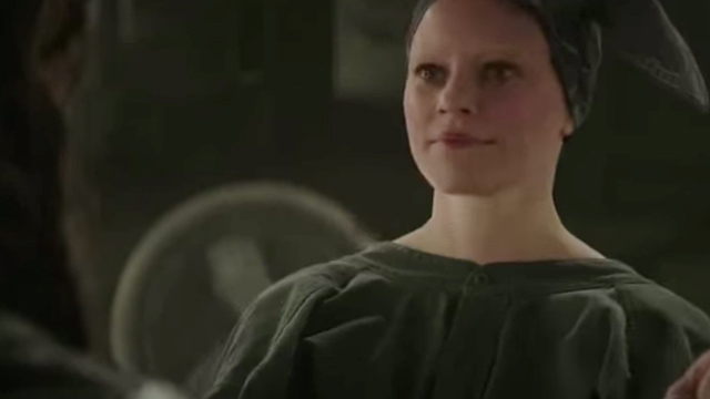EFFIE TRINKET. Firmly, as we see, on Team Katniss. Screengrab from YouTube