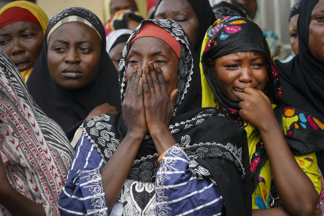 FUNERAL. Burundian Muslim women cry during a funeral service for the slain leader of the opposition party Union for Peace and Development (UPD), Zedi Feruzi, May 24 2015. Photo by Dai Kurokawa/EPA