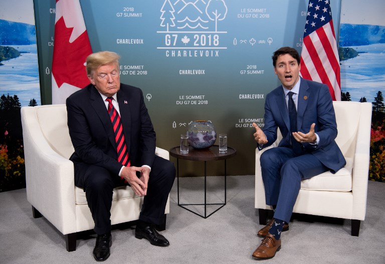 TIT FOR TAT. In this file photo taken on June 8, 2018, US President Donald Trump (L) and Canadian Prime Minister Justin Trudeau hold a meeting on the sidelines of the G7 Summit in La Malbaie, Quebec, Canada. Photo by Saul Loeb/AFP 
