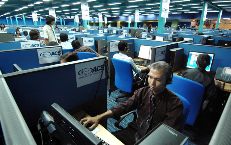 BPO GROWTH. The growth in BPO revenues is expected to offset any dip in remittances of overseas Filipino workers in 2016. Photo by Romeo Gacad/AFP  