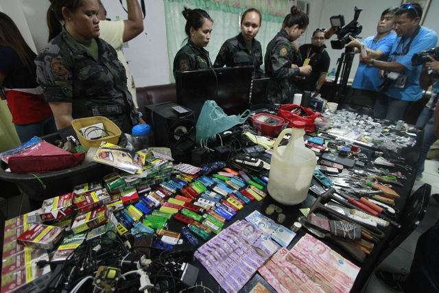 THE GREYHOUND OPERATION. Contraband, guns, and phones seized during the operation. Photo by Gelo Litonjua.  