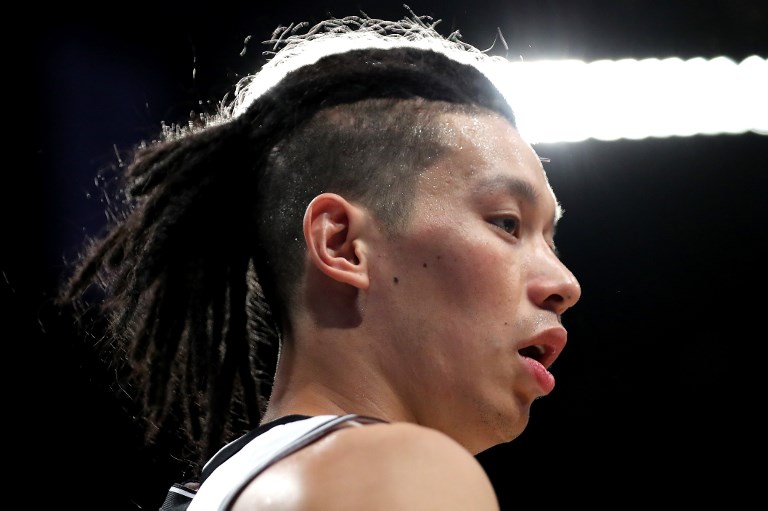 DREADLOCKED. After being told 'You want to be black' by Kenyon Martin for wearing dreadlocks, Jeremy Lin reminds K-Mart that he has Chinese tattoos. Photo by Abbie Parr/Getty Images/AFP 