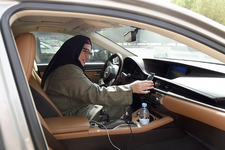 DRIVING FORCE. Saudi national and newly licensed Reem Farahat, an employee of Careem, a chauffeur car booking service, prepares for a customer shuttle using her car in the Saudi capital of Riyadh, on June 24, 2018. Photo by Fayez Nureldine/AFP 