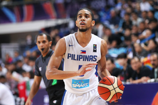 NOT IN MY HOUSE. Gabe Norwood of Gilas Pilipinas threw a block party and invited China’s Ailun Guo. Photo from FIBA 