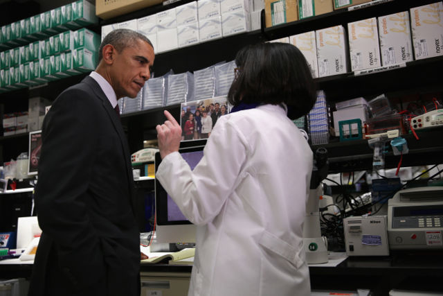 FIGHTING EBOLA. US President Barack Obama (L) listens to Chief of the Biodefense Research Section Nancy Sullivan as he tours the Vaccine Research Center at the National Institutes of Health in Bethesda, Maryland, USA, 02 December 2014. Photo by Alex Wong/EPA