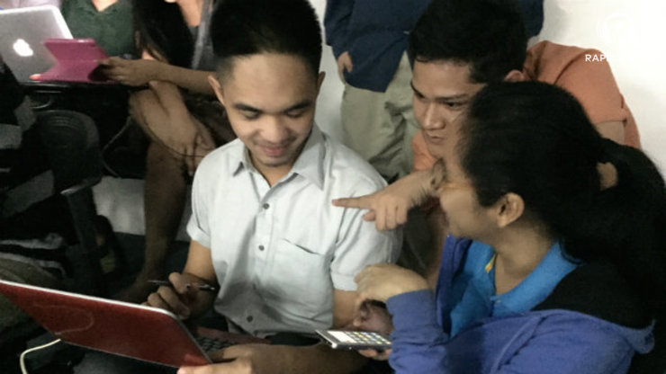 WITH A SMILE. Volunteers from all walks of life pitch in to crowdsource critical information during Typhoon Ruby (Hagupit) in the Philippines. All photos by Zak Yuson/Rappler