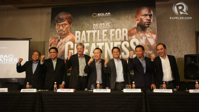 Representatives from GMA, ABS-CBN, TV5, Solar Sports and SM show of their fists at the 'Battle for Greatness' press conference. Photo by Mark Cristino 