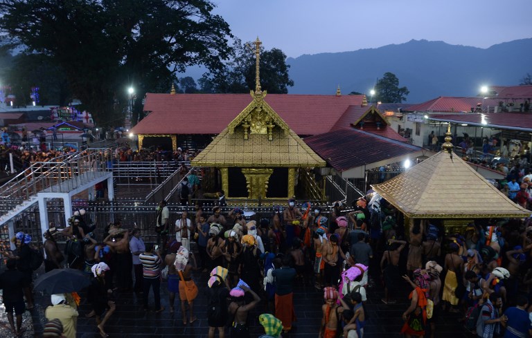 TEMPLE. Indian Hindu devotees are pictured at the Lord Ayyappa temple in Sabarimala in the southern state of Kerala on November 16, 2018. Photo by Arun Sankar/AFP 