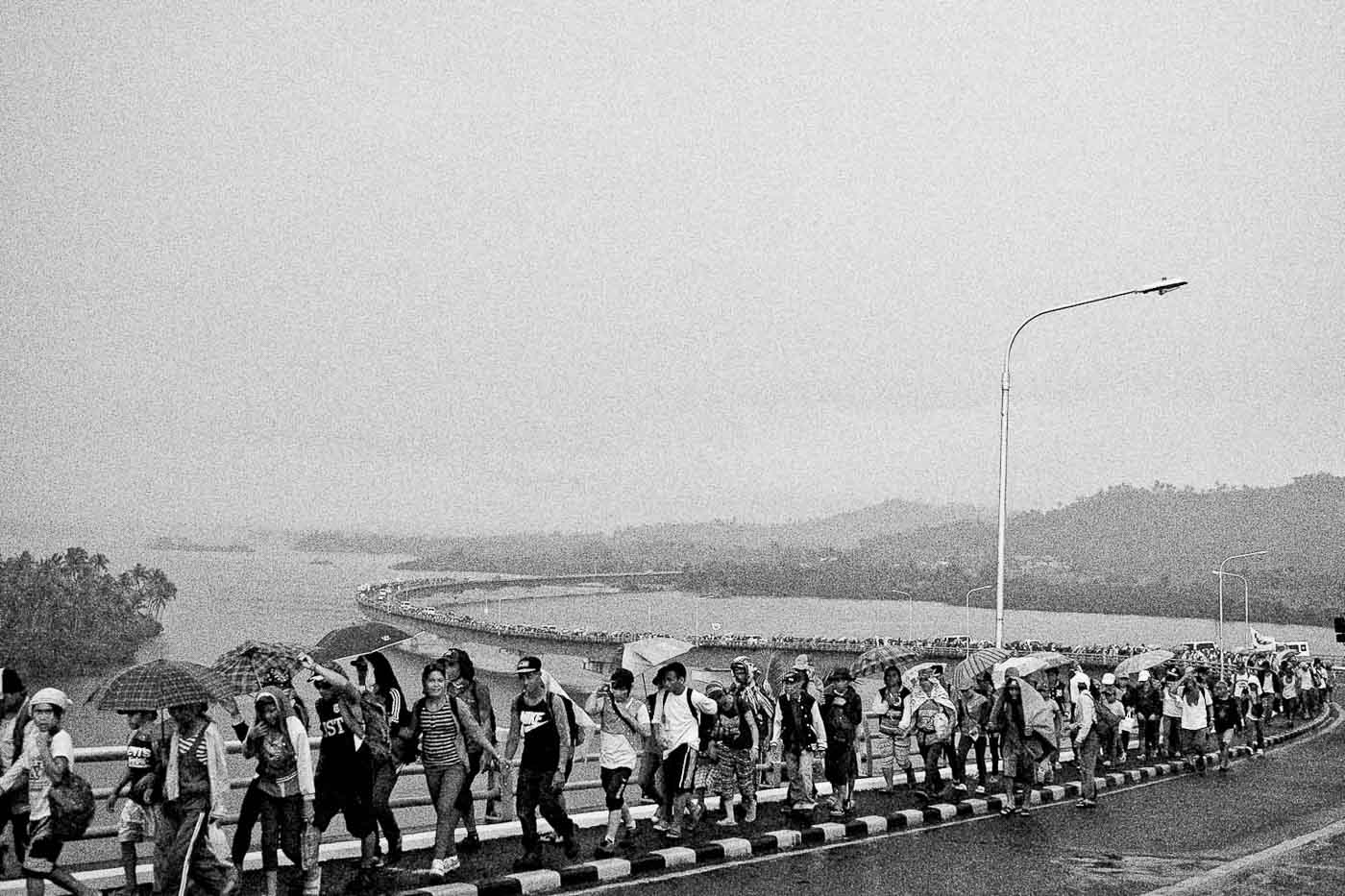 THE MARCH. A year after Haiyan, farmers and civil society groups march through San Juanico bridge to protest the allegedly slow response and rehabilitation efforts by government.  