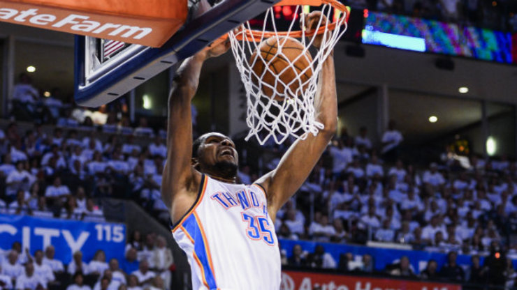 Oklahoma City Thunder's Kevin Durant throws down a two-handed slam. Photo by Larry W. Smith/EPA
