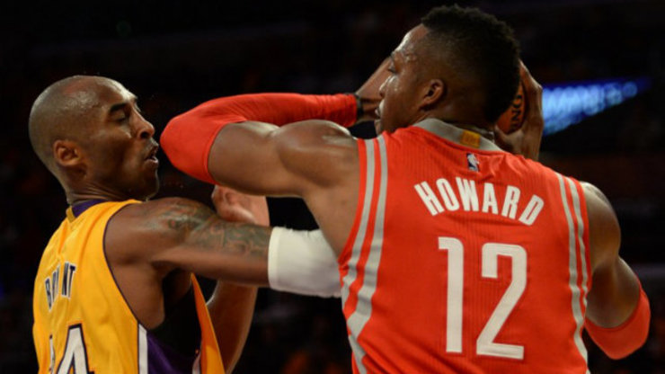 NOT FRIENDLY. Kobe Bryant (left) and Dwight Howard get in a tussle during the Lakers' first regular season NBA game. Photo by Robyn Beck/AFP