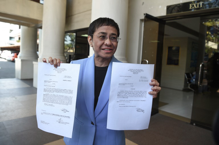  CHARGED. Rappler CEO and executive editor Maria Ressa posts bail for tax evasion charges at the Makati RTC on December 3, 2018. Photo by Ted Aljibe/AFP