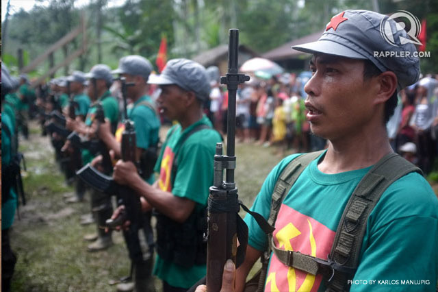 RESCUE MISSION. Members of the New People's Army rescue their comrades set for trial in Lianga, Surigao del Sur. Filep hoto by Karlos Manlupig/Rappler 