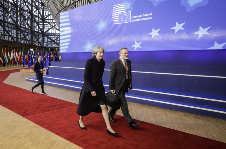 THERESA MAY. Britain's Prime minister Theresa May (L) and UK Permanent Representative to the EU Tim Barrow arrive to attend the first day of a European union summit in Brussels on December 14, 2017. Photo by Thierry Roge/AFP 