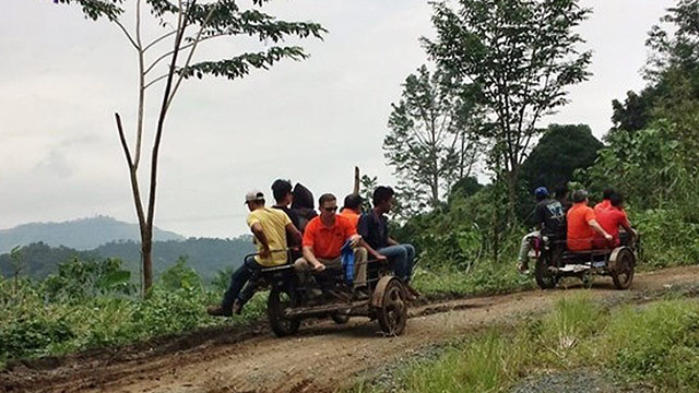 BRAVING THEIR WAY. Employees of The Hershey Company Philippines led by their general manager Matt Andersen (wearing sunglasses) ride the habal-habal or motorcycle taxis to reach their adopted community of Puray, in Rodriguez, Rizal. Photo from Hershey's