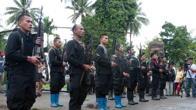 REBELS. NPA guerrillas belonging to the Front 73 Guerrilla Command in formation during the release of a government soldier they held as "prisoner of war" in June. Photo by Edwin Espejo/Rappler 