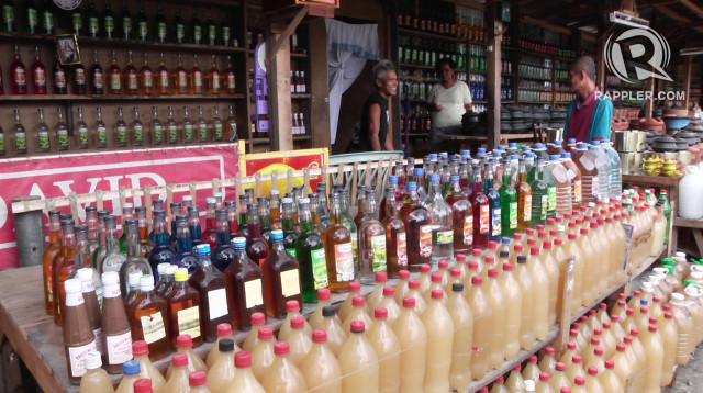 STREET-SIDE. Lambanog is sold in street-side stores like this one in Tiaong, Quezon for P100 for 3 bottles or P250 a gallon 