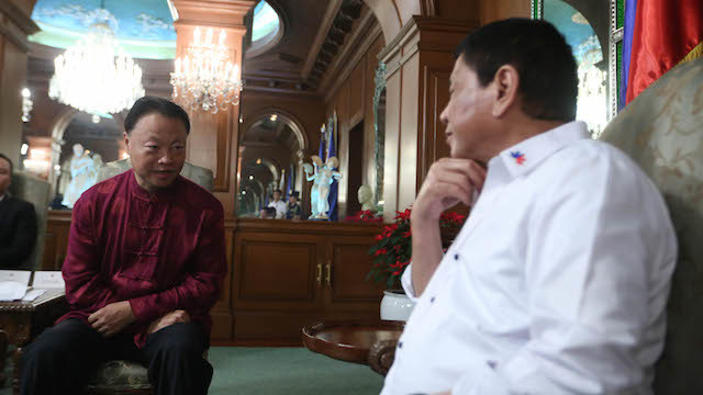 NEW FRIEND. File photo of the President with the Chinese ambassador to Manila. 