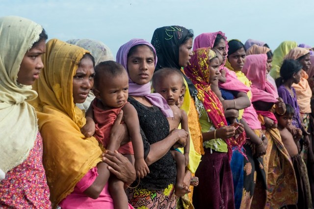NO HOME. In this photograph taken on November 12, 2017, women hold children at a makeshift camp in Rakhine state in Myanmar. File photo by Phyo Hein Kyaw/AFP 