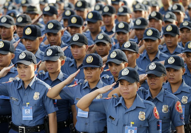 POLICE. Officers of the Philippine National Police force salute during ceremony. File photo by Francis R Malasig/EPA 