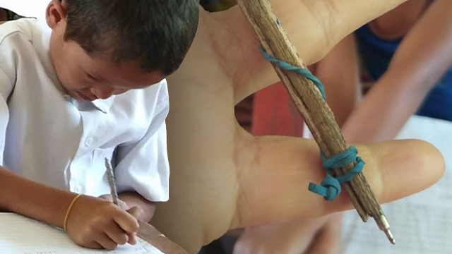 Grade 2 student uses makeshift ballpen for his seatwork.Photos from Maricor Bacunata 
