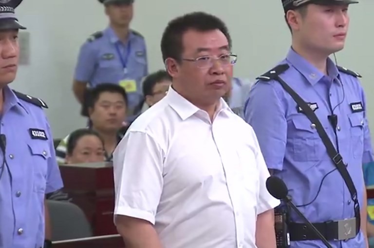 DETAINED. This handout video frame grab taken and released by Changsha Intermediate People's Court on August 22, 2017 shows Chinese rights lawyer Jiang Tianyong (center) appearing in court in Changsha in China's central Hunan province. Handout photo/Changsha Intermediate People's Court/AFP  