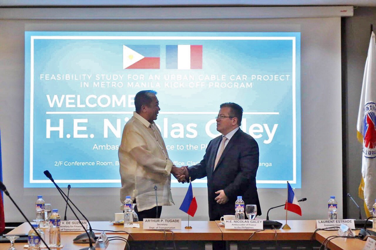 CABLE CAR. Transportation Secretary Arthur Tugade (left) and French Ambassador to the Philippines Nicolas Galey lead the kickoff program for a feasibility study on the proposed Metro Manila cable car system. Photo from the Department of Transportation  