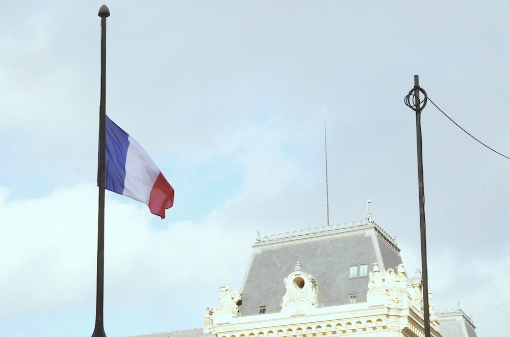 HALF MAST. A French flag flies at half mast to commemorate the November 13 attacks. Photo by Chad Versoza 