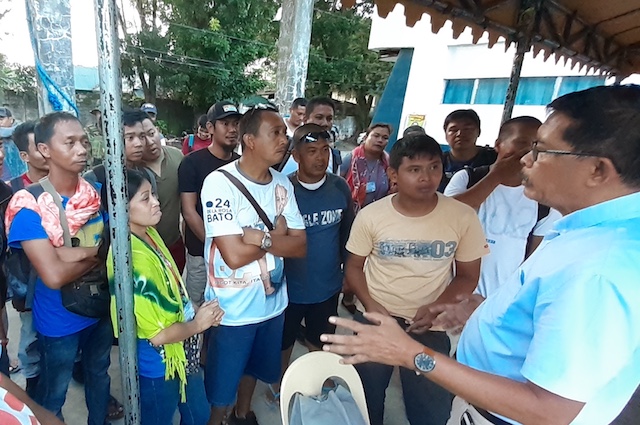 RELEASED. Some of the 21 terminated workers who were earlier accused as communist rebels, with their lawyer, Jose Max Ortiz (right), at Camp Alfredo Montelibano Sr in Bacolod City on November 6, 2019/Photo by Marchel Espina  
