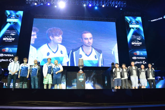 BEFORE THE BOUTS. Team Liquid and Wings stand together at the stage for the first and last time at ESL One Manila. 
