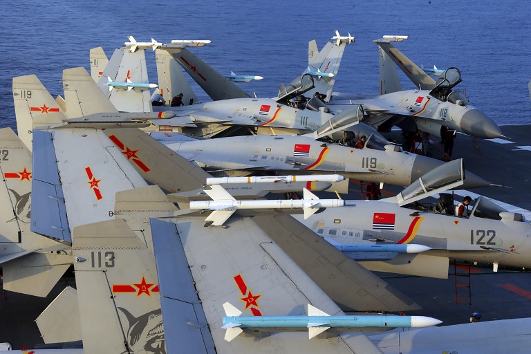 CHINA MUSCLE. This undated photo taken in April 2018 shows J15 fighter jets on China's sole operational aircraft carrier, the Liaoning, during a drill at sea. Drills like this riles Taiwan.
AFP  