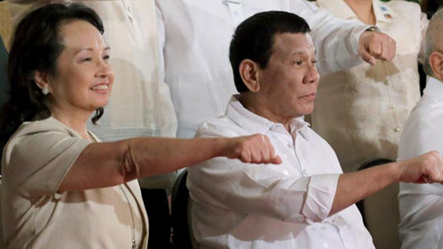DUTERTE ALLY. Speaker Gloria Macapagal Arroyo does President Rodrigo Duterte's signature fist pump in Malacañang on October 9, 2018. Malacañang photo 
