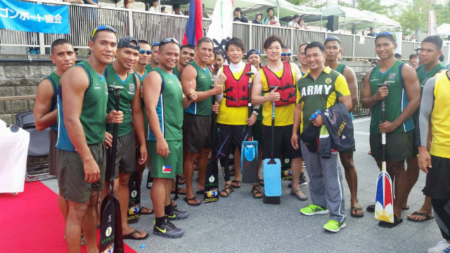 The Philippine Army team (in green) poses with two Japanese paddlers (in yellow) whom they had helped train in 2010. The Japanese National team came in second to Philippine Army in Osaka, Japan. Photo from Philippine Army Dragon Boat team 