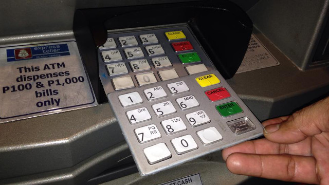 SKIMMING. A file photo showing the skimming techniques used by fraudsters at a BPI ATM in Bonifacio Global City.  