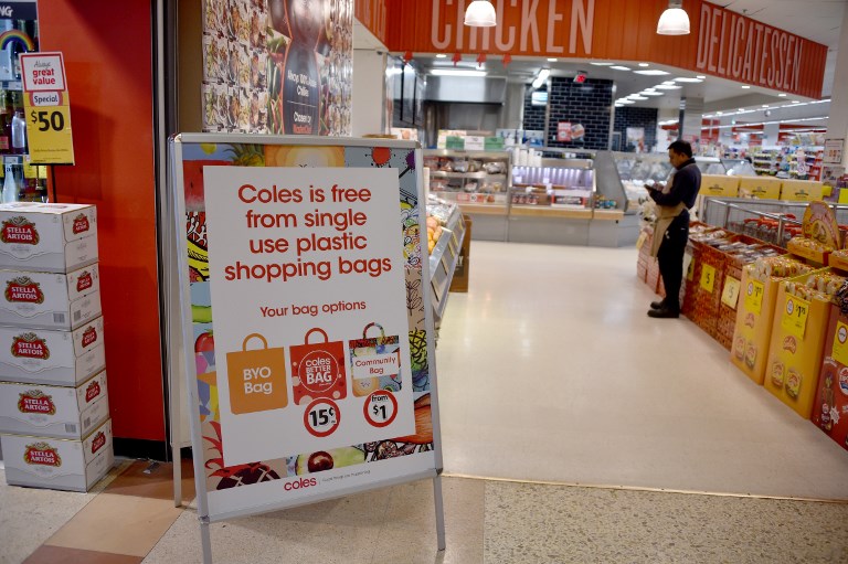 PLASTIC WAR. A sign, seen in a Coles supermarket, advises its customers of its plastic bag free in Sydney on July 2, 2018. Photo by Peter Parks/AFP 